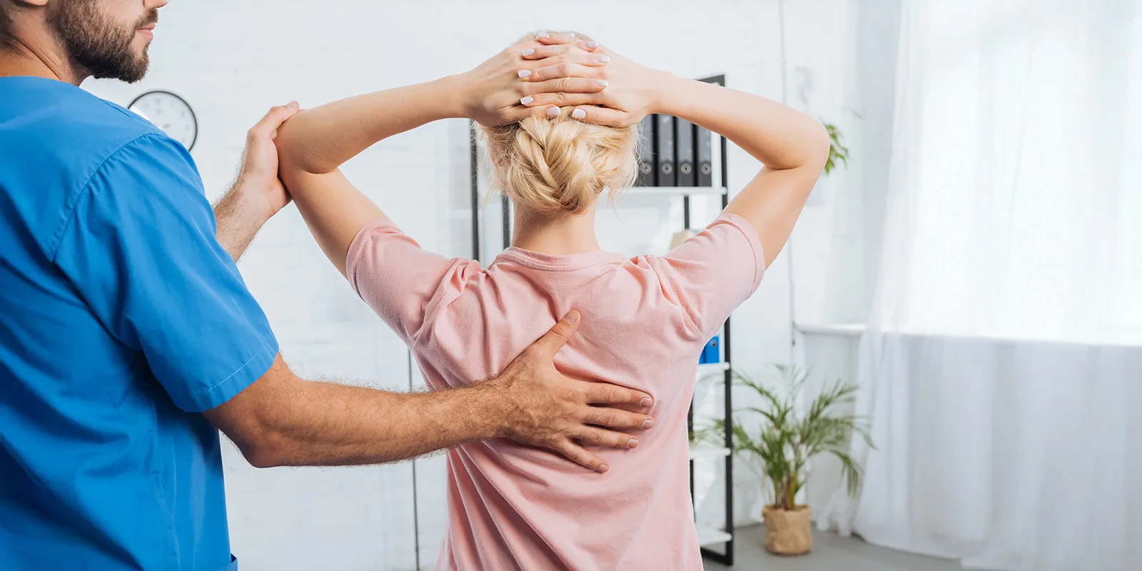 Chiropractor performing an adjustment on a patient in Southfield, MI